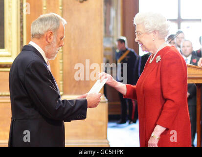 Mr. Michael Ward from Stone is made an MBE by Britain's Queen Elizabeth II at Windsor Castle. Stock Photo