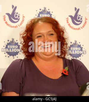 Donna Rhodes celebrates after winning a share of 45 million in Saturday's Euromillions jackpot, at Thornton Hall Hotel, Wirral. Stock Photo