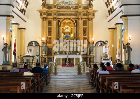 Interior of Iglesia de Nuestra Señora de Regla (Church of Our Lady of Regla), with Black Madonna on altar, Regla, Cuba Stock Photo