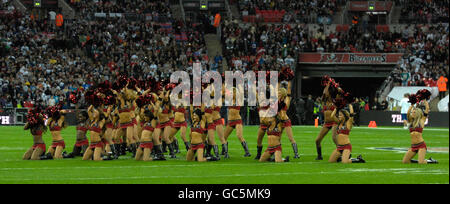 American Football - NFL - New England Patriots v Tampa Bay Buccaneers - Wembley Stadium. Tampa Bay Buccaneers' cheerleaders entertain the crowd Stock Photo