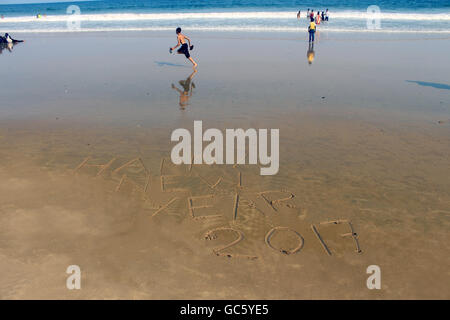 Happy new year 2017 written on sand. Welcome to new year. Stock Photo