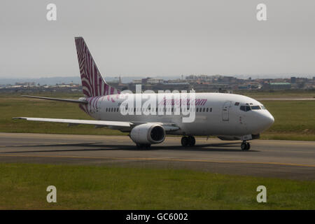a Boeing 737-300 of budget airline Jambojet taxis for takeoff from Jomo Kenyatta International Airport. Stock Photo