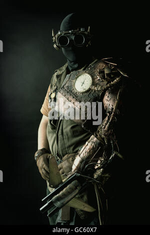 Futuristic soldier posing with gun and armor Stock Photo