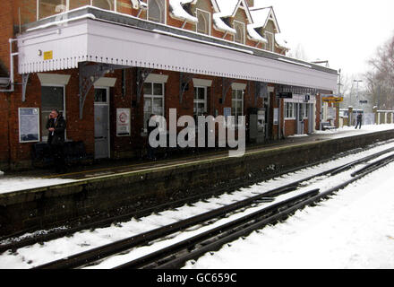 Commuters wait for delayed London bound trains at West Malling station in Kent, as swathes of Britain were hit by a fresh wave of snow. Stock Photo