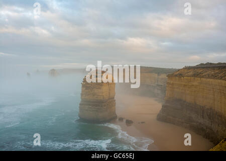 Fog shrouds Australia's iconic Twelve Apostles on the Great Ocean Road Stock Photo