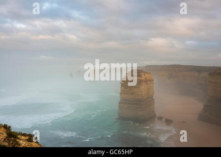 Fog shrouds Australia's iconic Twelve Apostles on the Great Ocean Road Stock Photo