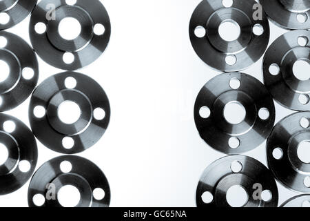 Border of flat steel welding flanges on white background. Stock Photo