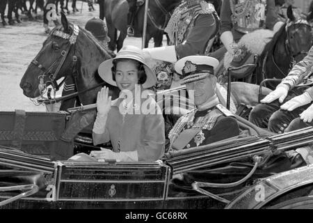 Queen Sirikit of Thailand with the Duke of Edinburgh in an open carriage as they left Victoria Station, London, on a processional drive to Buckingham Palace. Stock Photo