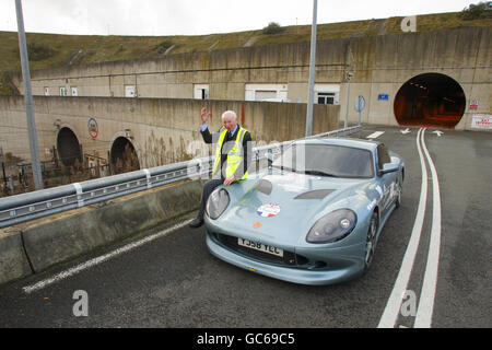 Former Formula One World Champion John Surtees after being the first person to drive a sports car the full length of the Channel Tunnel from Folkestone in Kent to Coquelles in France. Stock Photo