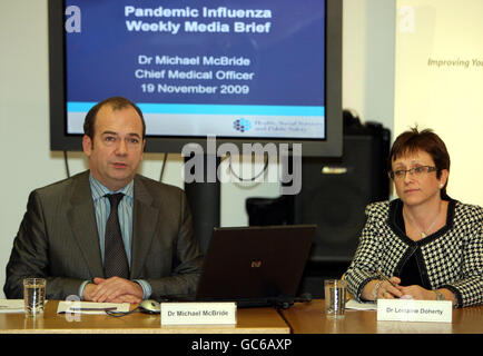 Dr Michael McBride with Dr Lorraine Doherty speaking at the weekly media briefing in Belfast on Swine Flu. Stock Photo