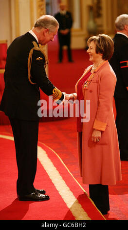 TV celebrity chef Delia Smith receives her Commander of the British Empire Medal (CBE) from the Prince of Wales at an investiture ceremony at Buckingham Palace. Stock Photo