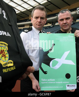 Asst Chief Constable of Lothian and Borders Police Iain Livingstone (left) and referee Brian Winter at the launch of the domestic abuse phase of the Violence Reduction Unit`s anti-violence campaign at Hampden Park in Glasgow. Stock Photo