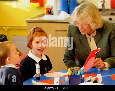 During her visit to Rose Hill Westonbirt School near to her Highgrove home in Tetbury, Gloucestershire, the Duchess of Cornwall hears from three year old Anne MacMillan (second from left) that she hoped to get a Shetland Pony from Father Christmas. Stock Photo