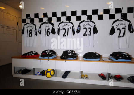 Soccer - Barclays Premier League - Fulham v Bolton Wanderers - Craven Cottage. Fulham football shirts hang in the changing room Stock Photo