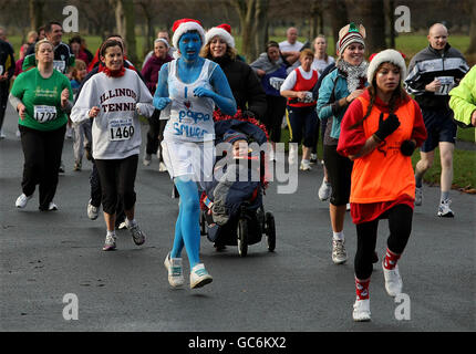 Competitors take part in the 19th annual Jingle Bells 5K fun run in aid of DEBRA Ireland (the Dystrophic Epidermolysis Bullosa Research Association) in Phoenix Park, Dublin. Stock Photo