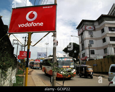 A general view of Vodafone mobile phone signs in Mangalore, Karnataka, India. Stock Photo