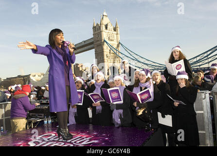 Last year's X Factor winner, Alexandra Burke created a magic moment with the public at the Quality Street Caroleoke, on the South Bank in central London. Stock Photo