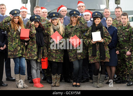 (left to right) Una Healy, Vanessa White, Mollie King, Rochelle Wiseman and Frankie Sandford of girl group The Saturdays arrive at RAF Northolt, west London to launch this year's uk4u Thanks! gift box campaign. Stock Photo