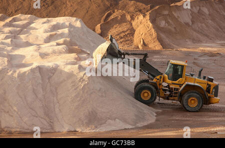 Salt for gritting the roads is piled up at the Salt Union mine in Winsford Cheshire, as weather experts predict a downturn in temperatures. Stock Photo