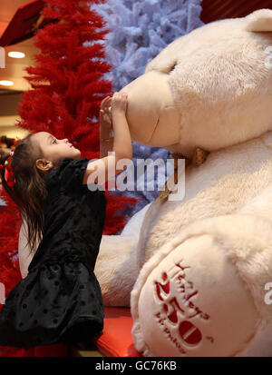 Waist up of handsome smiling man showing teddy bear for camera Stock Photo  by ©iakovenko123 273718220