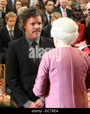 Mr. Peter Gordon is made an Officer of the New Zealand Order of Merit by The Queen at Windsor Castle. Stock Photo