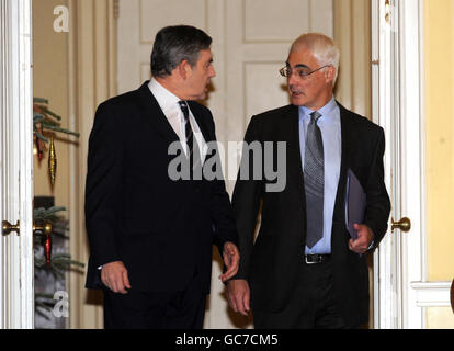 Chancellor Alistair Darling (right) arrives with Prime Minister Gordon Brown (left for a cabinet meeting at 10 Downing Street ahead of his pre-budget report later today. Stock Photo