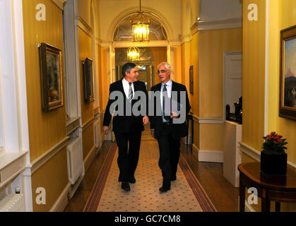 Chancellor Alistair Darling (right) arrives with Prime Minister Gordon Brown (left for a cabinet meeting at 10 Downing Street ahead of his pre-budget report later today. Stock Photo