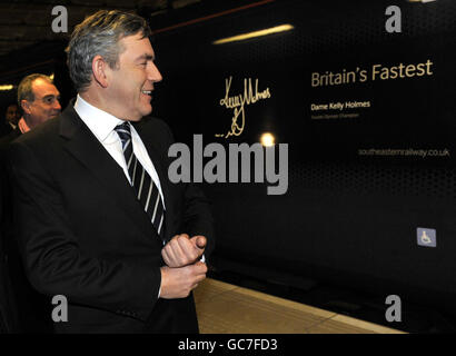 Prime Minister Gordon Brown in front of a train named after athlete Kelly Holmes at St Pancras Station in London on the first day of the new high speed Javelin train services.