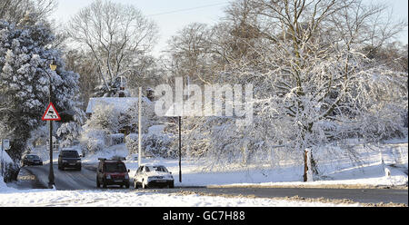 A road sign reminds drivers to take care in Stock village in Essex, after heavy snow fell across the county. Stock Photo