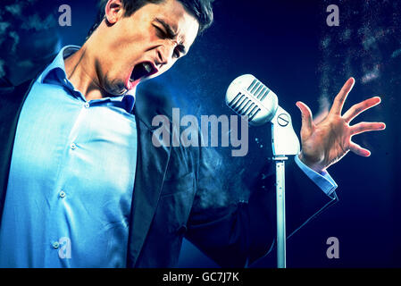Young handsome man singing Stock Photo
