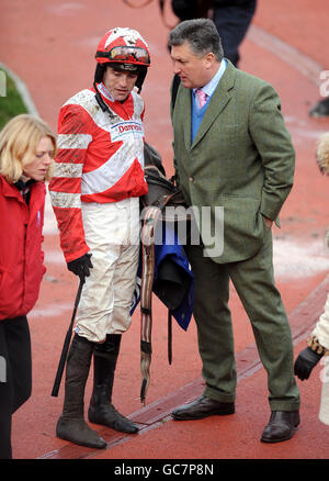 Jockey Ruby Walsh (left) and trainer Paul Nicholls (right) celebrate second place on The Tother One after competing in The Neptune Investment Management Steeple Chase (Handicap) Stock Photo