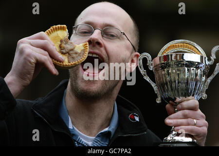 Barry Rigby poses for photographers after becoming the World Pie Eating Champion at Harry's Bar in Wigan. Mr Rigby was crowned at the 2009 champion after taking just 47 seconds to finish the pie. Stock Photo