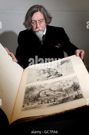 Stephen Calloway, Curator of Prints in the Word and Image Department of the Victoria and Albert Museum, London, examines a book of cartoons by British caricaturist James Gillray, which were originally censored in the 19th century, and lay hidden in government archives for over 100 years. Stock Photo