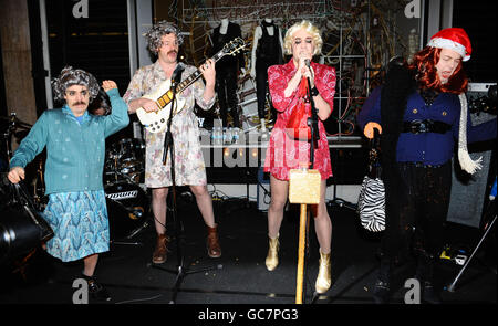 Michael Fielding, Julian Barratt, Noel Fielding and Rich Fulcher of the Mighty Boosh perform after they turned on the Christmas Lights at the Stella McCartney store in London. Stock Photo