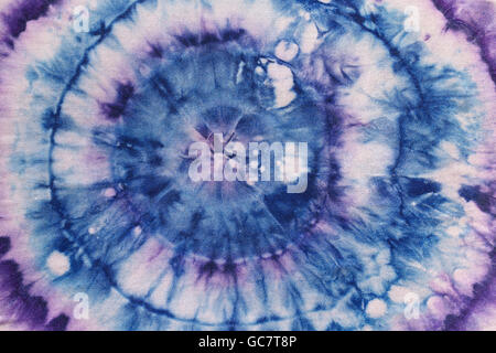 abstract pattern from blue and violet concentric circles on silk nodular batik Stock Photo