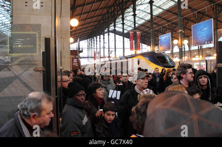 Passengers disembark onto the platform from a Eurostar train from London at Gare du Nord station in Paris, since services have resumed following the cold weather over the weekend.