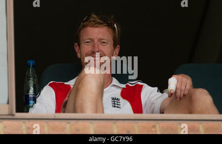 England's Paul Collingwood smiles as he sits in the dressing room nursing his injured finger during the second Test at Kingsmead, Durban, South Africa. Stock Photo