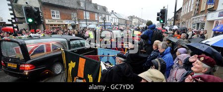 Mourners gather to pay their respects as three hearses containing the bodies of Lance Corporal Michael Pritchard, 22, of the 4th Regiment, Royal Military Police, Lance Corporal Christopher Roney, 23, of 3rd Battalion The Rifles and Lance Corporal Tommy Brown, of the Parachute Regiment, are carried through the streets of Wootton Bassett during their repatriation to the UK. Stock Photo