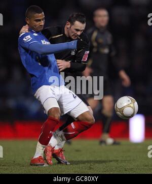 Portsmouth's Kevin-Prince Boateng, right, runs for the ball with ...