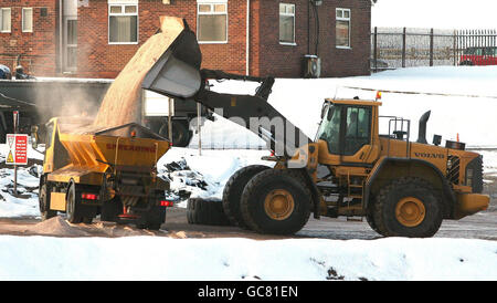 A gritter is refilled at Salt Union, Winsford Rock Salt Mine in Cheshire. Stock Photo