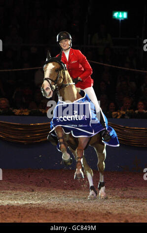Great Britain's Ellen Whitaker riding Kanelier wins in the Accenture Stakes during the London International Horse Show at the Olympia Exhibition Centre, London. Stock Photo
