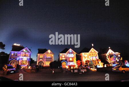 Runton Road in Branksome, Dorset - a quiet seaside cul-de-sac - has become something of a Christmas attraction as neighbours try to out-do each other with their festive lights. Stock Photo