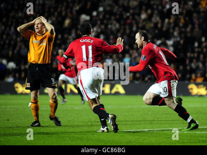 Manchester United's Wayne Rooney (right) celebrates his opening goal during the Barclay's Premier League match at the KC Stadium, Hull. Stock Photo