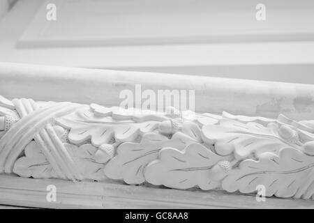 Beautiful elements of luxury wall design, white stucco mouldings over light background, antique plastering Stock Photo