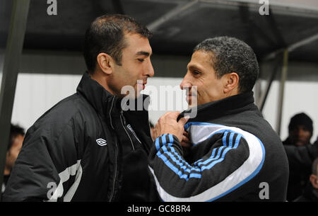 Newcastle manager Chris Hughton and West Bromwich Albion manager Roberto Di Matteo (left) in conversation prior to kick off during the Coca-Cola Championship match at St James Park, Newcastle. Stock Photo