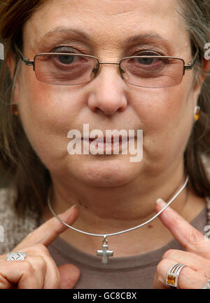 British Airways employee Nadia Eweida, 58, outside the Royal Courts of Justice in central London, where she is appealing against a ruling which cleared British Airways of discriminating against her by asking her to stop wearing a cross at work. Stock Photo