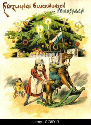 Christmas, children with present, festive decorated Christmas tree, 'Herzlichen Glueckwunsch zu den Feiertagen', lithograph, Germany, 1902, Additional-Rights-Clearences-Not Available Stock Photo