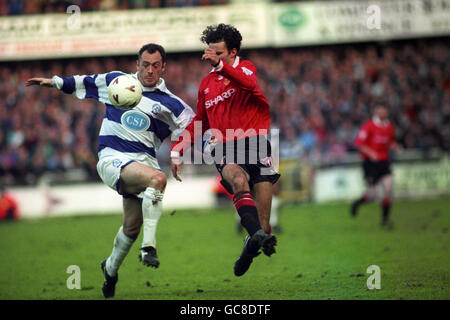 Queens Park Rangers' David Bardsley (l) and Manchester United's Ryan Giggs (r) battle for the ball. Stock Photo