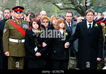 (Left to right) Sgt Wayne Ward, fiance Sian Goodenough and parents Jacqueline and Desmond arrive for the funeral of Lance Corporal Adam Drane, 23, of 1st Battalion, The Royal Anglian Regiment at St Mary's Church, Bury St Edmunds. Stock Photo