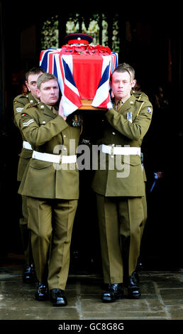 The coffin of Lance Corporal Adam Drane, 23, of 1st Battalion, The Royal Anglian Regiment leaves St Mary's Church, Bury St Edmunds following the funeral service. Stock Photo